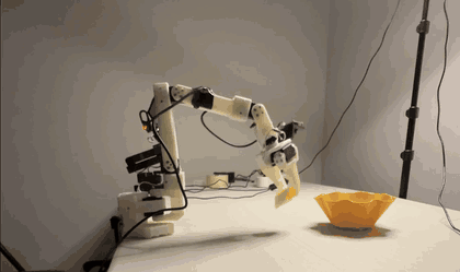 The SO-101 arm grasping a foam pool noodle and dropping it into a cup
